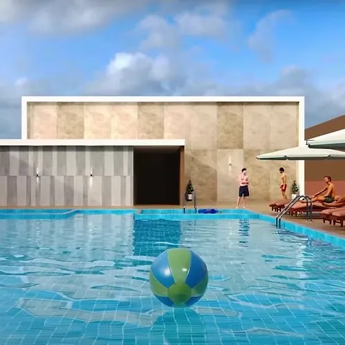 A rooftop swimming pool with loungers at Aparna Moonstone